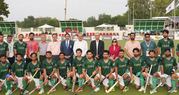 A group photograph of the Wafaqi Mohtasib, Mr. Naveed Kamran Baloch with the players and officials of Pakistan Hockey Federation prior to the beginning of Pakistan-South Korea Hockey match at the Naseer Bunda Hockey Stadium, Islamabad on 04.08.2026.